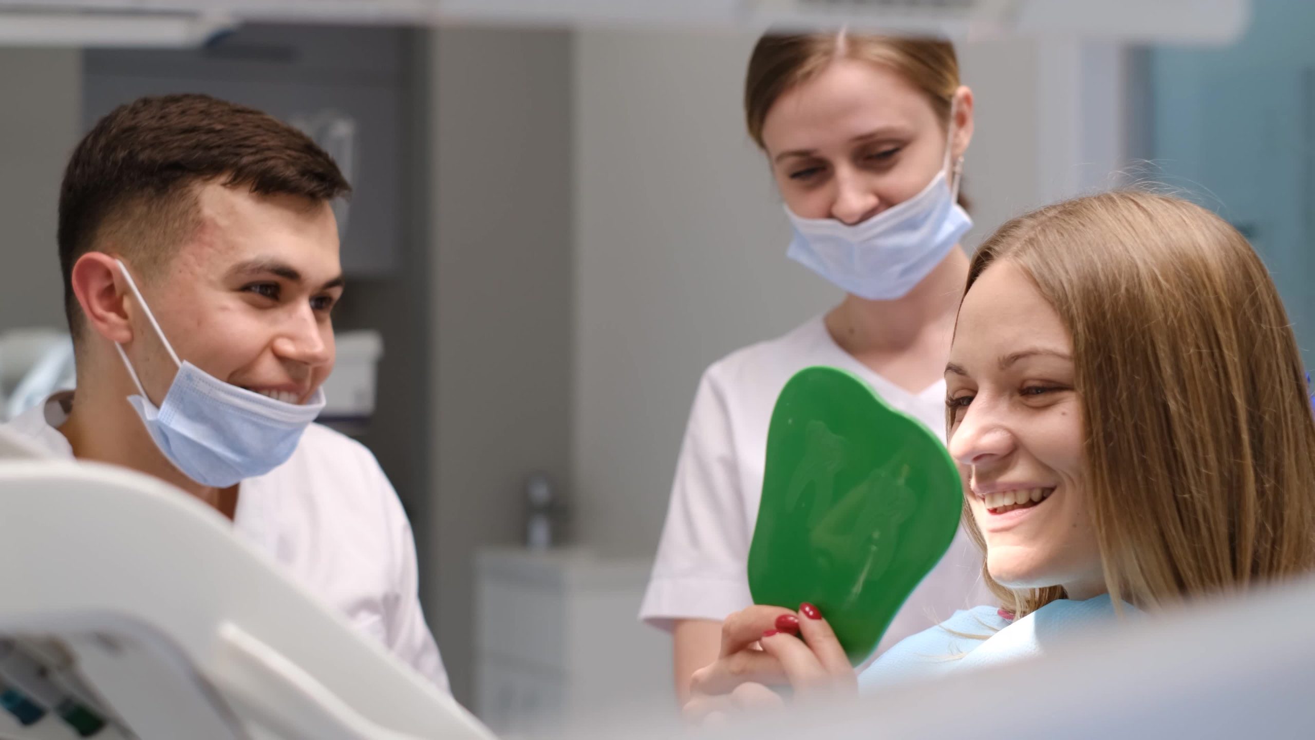 A smiling patient receiving a dental implant consultation at Implant & Cosmetic Dentistry of Northern Indiana in Rochester, IN; phone 360-800-2013.